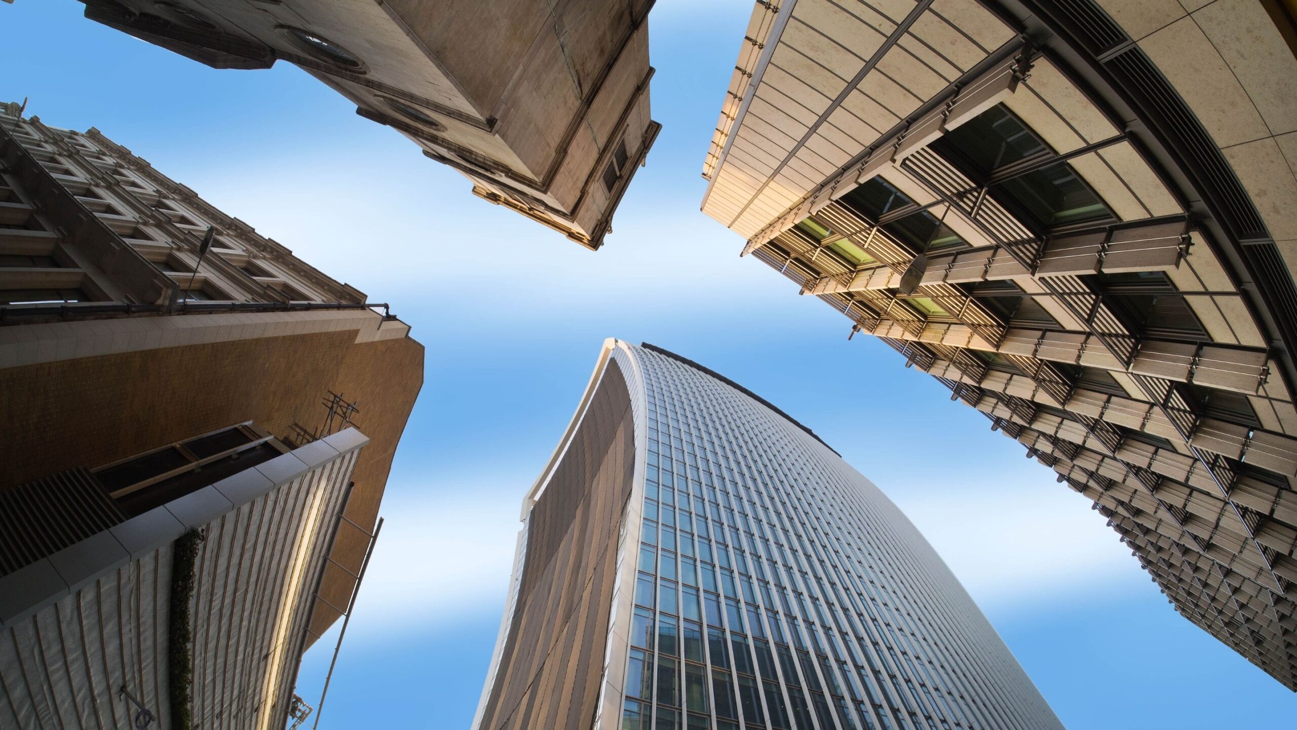 Blue sky between buildings wallpaper